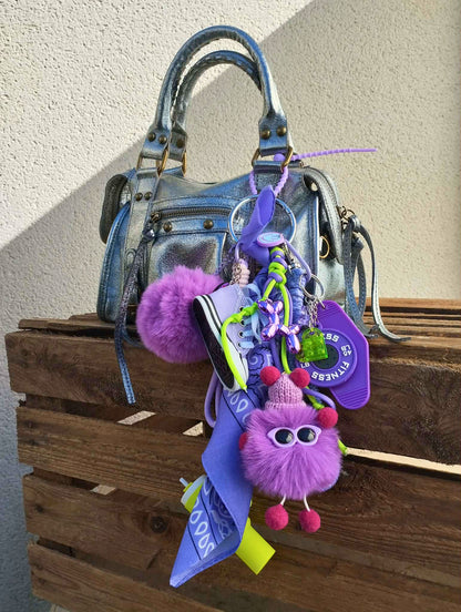 Gri-gri de sac violet et jaune amusant avec charms smileys et éléments graphiques, création artisanale française Totem Pop